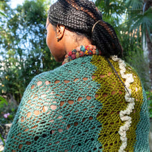 Load image into Gallery viewer, A woman wears a hand-crocheted shawl featuring chevron lace and a row of ruffles down the center back
